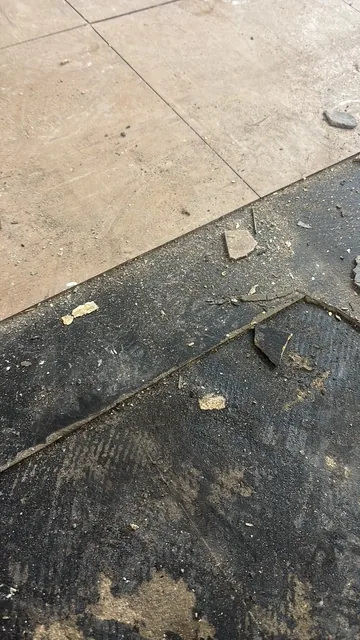 Black bitumen mastic floor removal in a SE4 flat